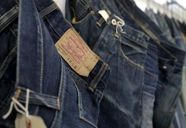 Levi's jeans hanging on a wall at Levi's innovation lab in San Francisco, California,  on March 21, 2019. (Jeff Chiu/AP Photo)