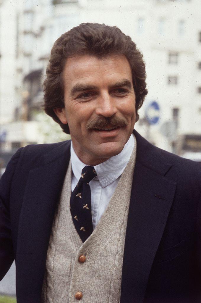 Tom Selleck in London, filming an episode of 'Magnum PI' on May 2, 1985 (©Getty Images | <a href="https://www.gettyimages.com/detail/news-photo/american-actor-tom-selleck-in-london-where-he-is-filming-an-news-photo/3140789">Hulton Archive</a>)