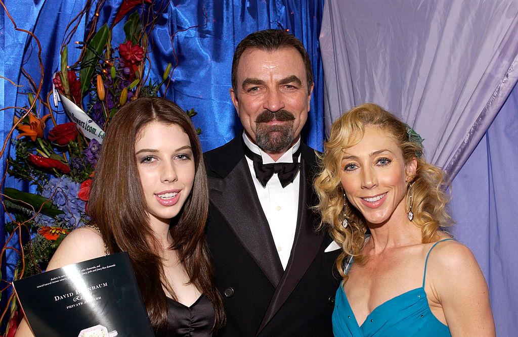 Selleck with his daughter, Hannah, and wife, Jillie Mack, at the Peoples Choice Awards, 2005 (©Getty Images | <a href="https://www.gettyimages.com/detail/news-photo/tom-selleck-daugher-hannah-and-wife-jillie-mack-are-seen-at-news-photo/51937669">Amanda Edwards</a>)