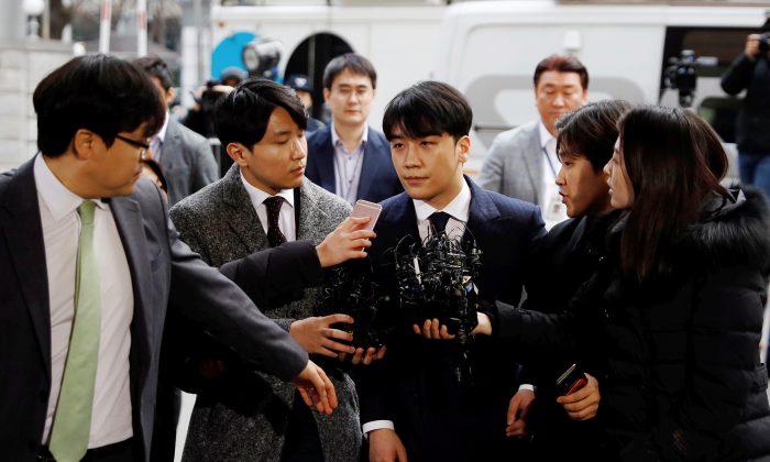 Seungri, a member of South Korean K-pop band Big Bang, arrives to be questioned over a sex bribery case at the Seoul Metropolitan Police Agency in Seoul, South Korea, March 14, 2019. (Kim Hong-Ji/Reuters)
