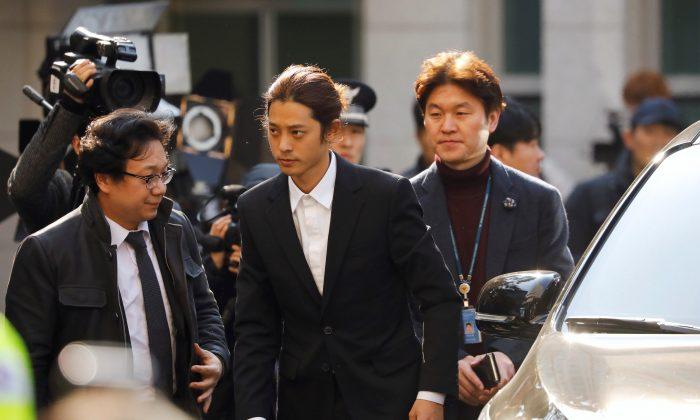 South Korean singer Jung Joon-young arrives for questioning on accusations of illicitly taping and sharing sex videos on social media, at the Seoul Metropolitan Police Agency in Seoul, South Korea, March 14, 2019. (Kim Hong-Ji/Reuters)
