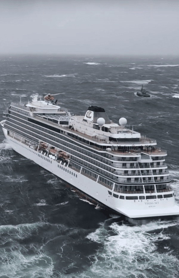In this image taken from video made available by CHC helicopters, helicopters fly over the cruise ship Viking Sky after it sent out a Mayday signal because of engine failure in windy conditions off the west coast of Norway, on March 23, 2019. (CHC helicopters via AP)
