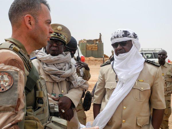 Colonel Gabriel Soubrier (L) from the Barkhane mission in Africa's Sahel region, speaks with Anderamboukane prefect Moussa Diallo (C) and Menaka region governor Daouda Maiga (R) at the military base of Malian Army forces (Fama) in Anderamboukane, Menaka region, on March 22, 2019. (AGNES COUDURIER/AFP/Getty Images)