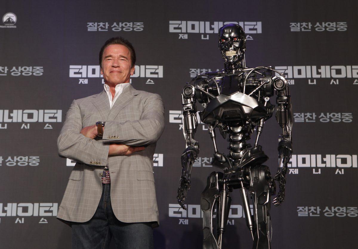 Actor Arnold Schwarzenegger (L) at a press conference on the film "Terminator Genisys" at the Ritz Carlton Hotel in Seoul on July 2, 2015. (Chung Sung-Jun/Getty Images for Paramount Pictures International)