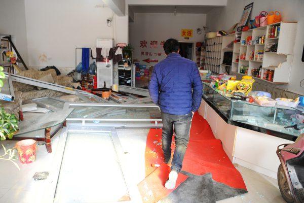A man enters a damaged shop following an explosion at a pesticide plant owned by Tianjiayi Chemical nearby, in Yancheng City, Jiangsu Province, China on March 22, 2019.  (Reuters)