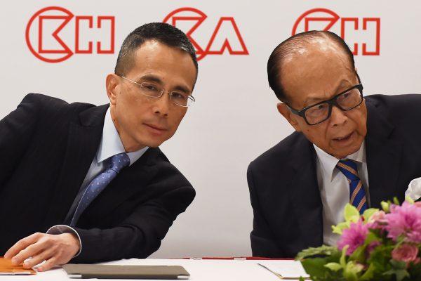 Hong Kong's richest man Li Ka-shing (R), 89, and his son Victor attend a press conference in Hong Kong on March 16, 2018. (Anthony Wallace/AFP/Getty Images)