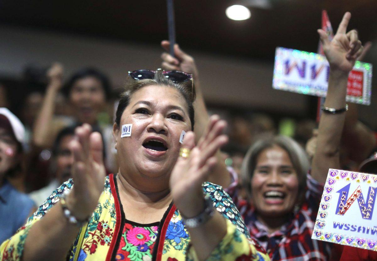 Supporters of Pheu Thai Party react after unofficial results during the general election in Bangkok, on March 24, 2019. (Athit Perawongmetha/Reuters)