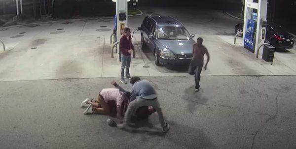 The cousins wrestle with the gunman, as his shirtless accomplice runs over. (Broward County Sheriff)