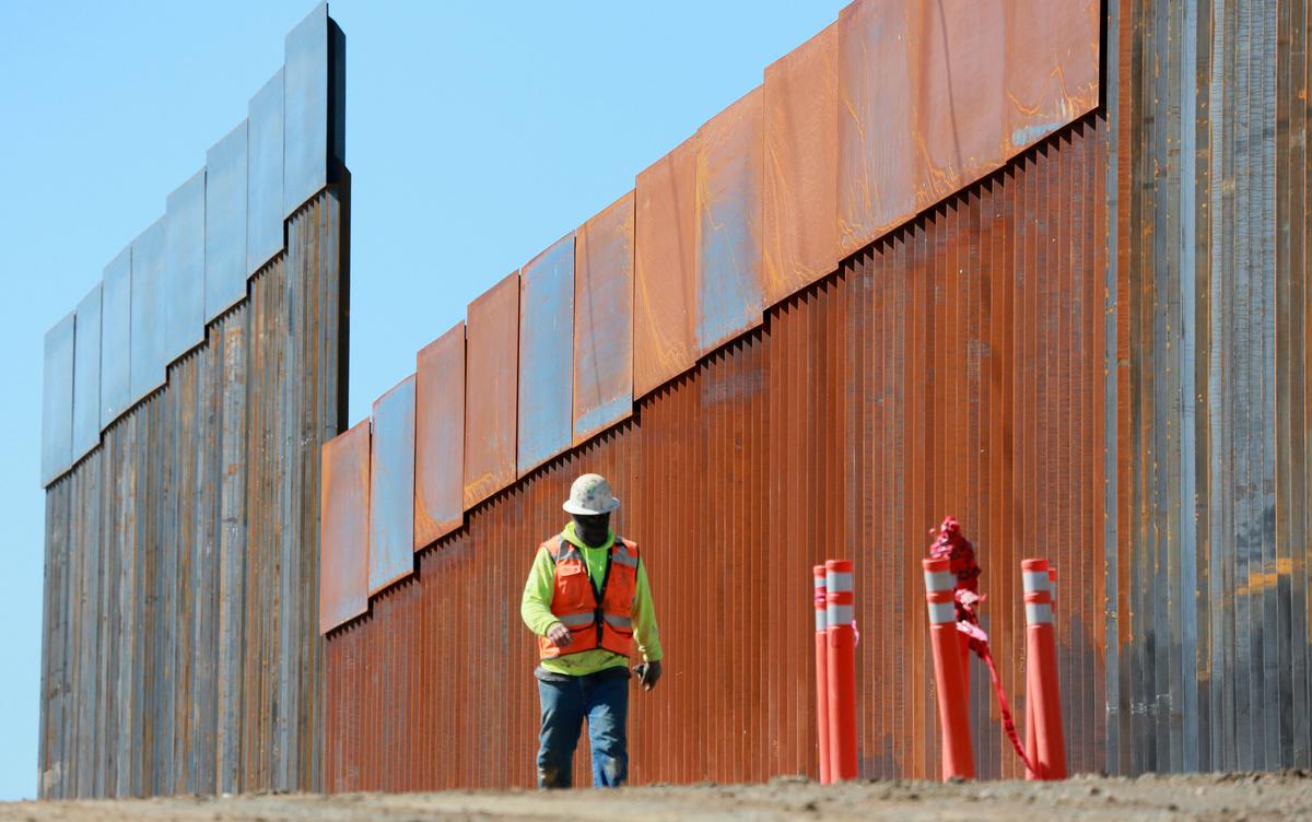 Construction workers build a secondary border wall in Otay Mesa, Calif., on Feb. 22, 2019. (Sandy Huffaker/Getty Images)