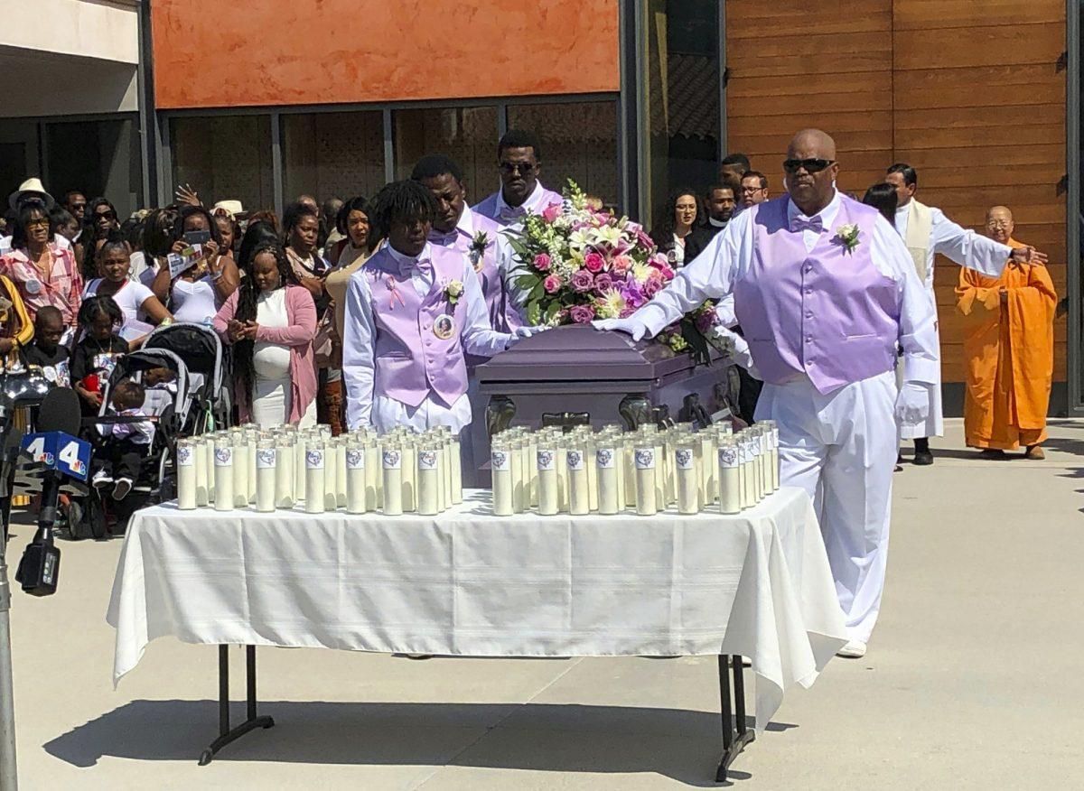 Mourners attend the funeral service of Trinity Love Jones, the 9-year-old whose body was found this month stuffed in a duffel bag along an equestrian trail, at St. John Vianney Catholic Church in Hacienda Heights, Calif., on March 25, 2019. (John Rogers/AP Photo)