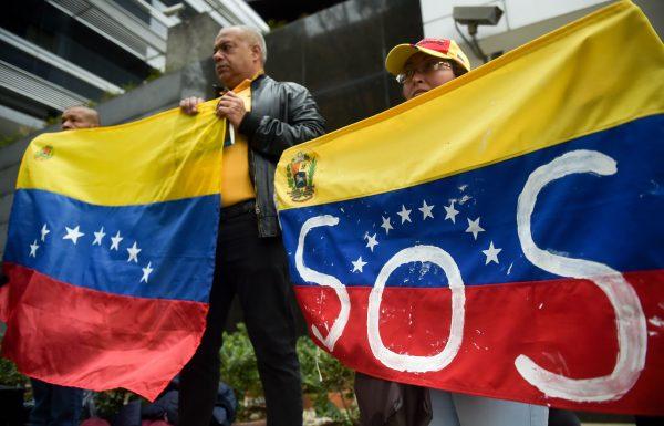 Venezuelans living in Colombia hold a demonstration against a massive blackout that has left millions without power in their country, in front of the U.N. headquarters in Bogota, on March 11, 2019. (Raul Arboleda/AFP/Getty Images)