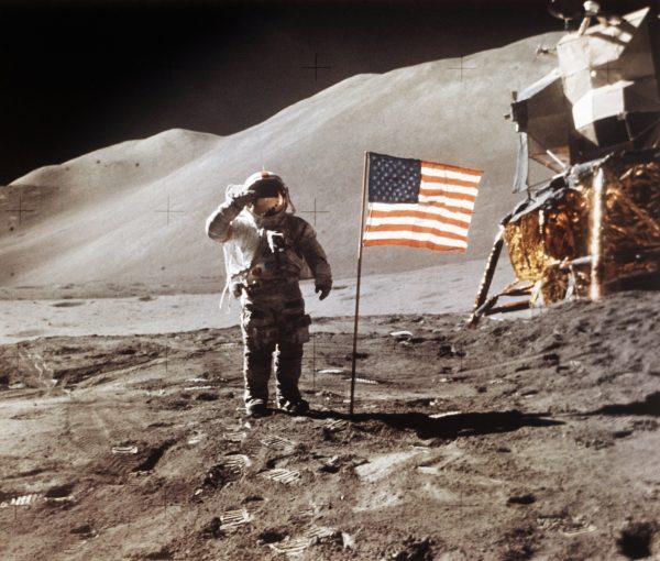 Apollo 15 Lunar Module Pilot James B. Irwin salutes while standing beside the fourth American flag planted on the surface of the moon, on July 30, 1971. (NASA via AP)