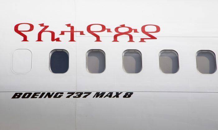 Other Ethiopian Airlines aircraft are seen in the distance behind an Ethiopian Airlines Boeing 737 Max 8 as it sits grounded at Bole International Airport in Addis Ababa, Ethiopia Saturday, March 23, 2019. (Mulugeta Ayene/AP)