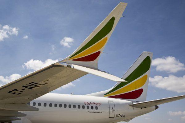 Other Ethiopian Airlines aircraft are seen in the distance behind an Ethiopian Airlines Boeing 737 Max 8 as it sits grounded at Bole International Airport in Addis Ababa, Ethiopia, on March 23, 2019. (Mulugeta Ayene/AP)