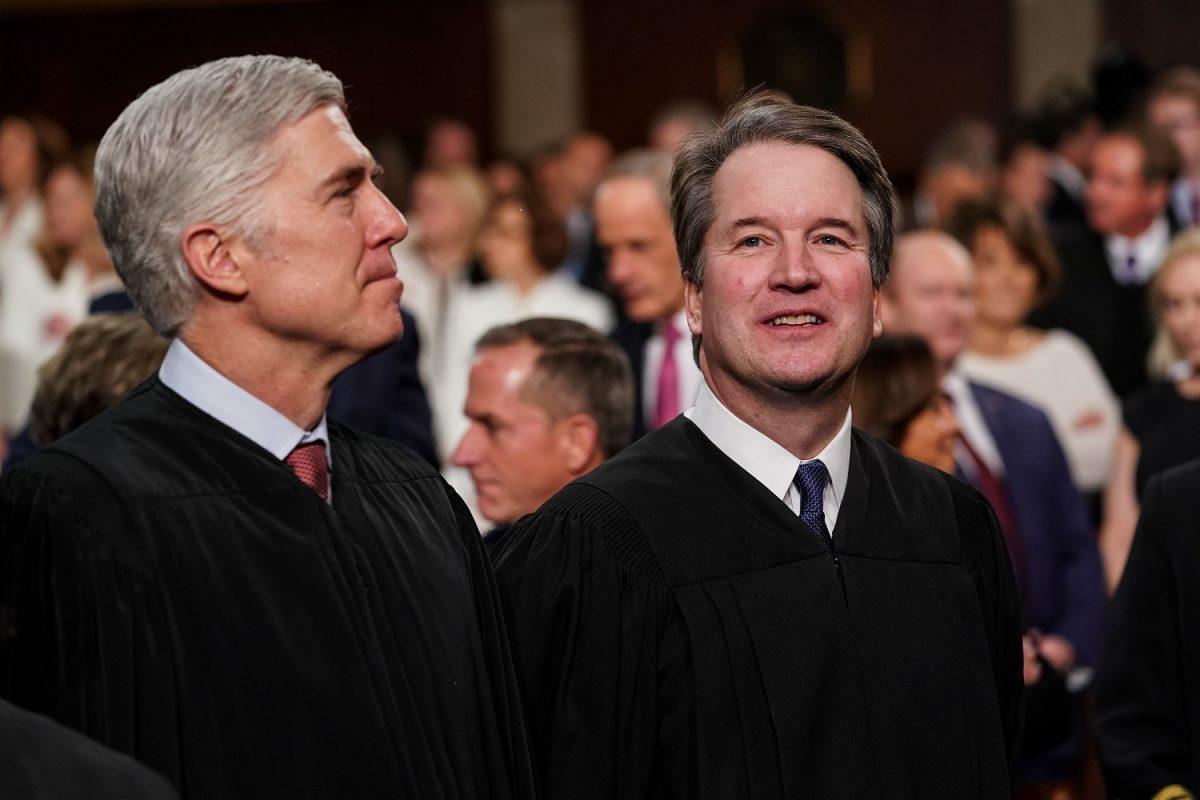  Associate justices of the Supreme Court Neil Gorsuch and Brett Kavanaugh in the chamber of the U.S. House of Representatives at the U.S. Capitol in Washington on Feb. 5, 2019. (Doug Mills-Pool/Getty Images)