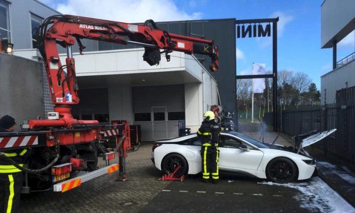 Firefighters Dunk Smoking BMW Hybrid Electric Vehicle in Huge Vat to Put It Out