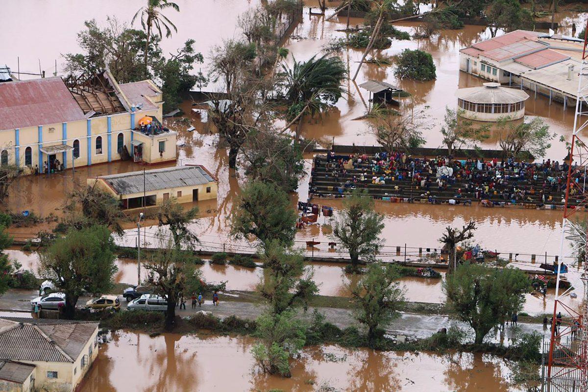 Residents gather stranded on the stands of a stadium in a flooded area of Buzi, central Mozambique, on March 20, 2019, after the passage of cyclone Idai. (Adrien Barbier/AFP/Getty Images)