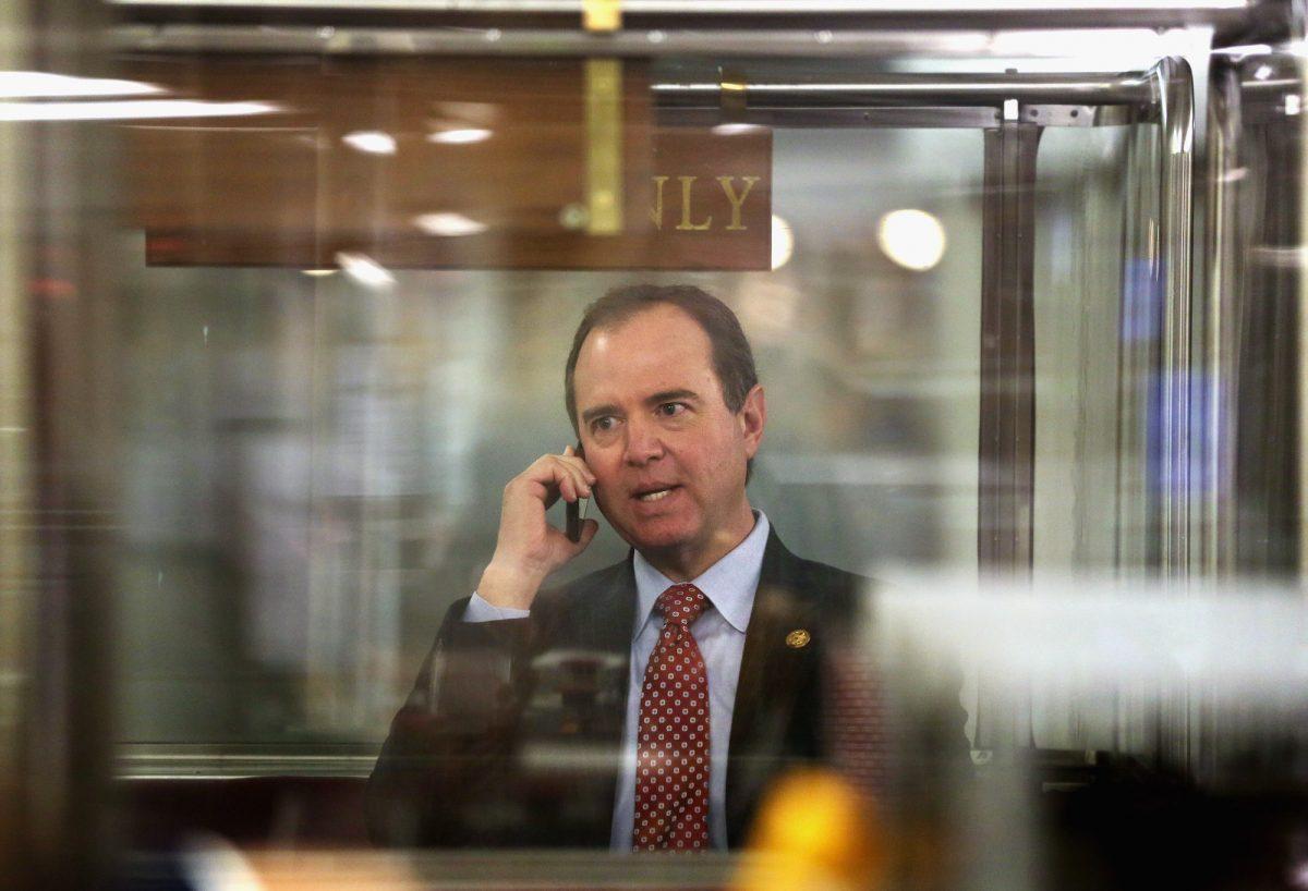 Rep. Adam Schiff (D-Calif.) talks on his phone while he is riding the House subway in Washington on Jan. 28, 2015. (Alex Wong/Getty Images)