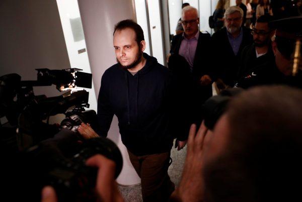 Joshua Boyle walks through the Toronto Pearson International Airport after arriving in Canada on Oct. 13, 2017, nearly five years after he and his wife were taken hostage in Afghanistan. (REUTERS/Mark Blinch)