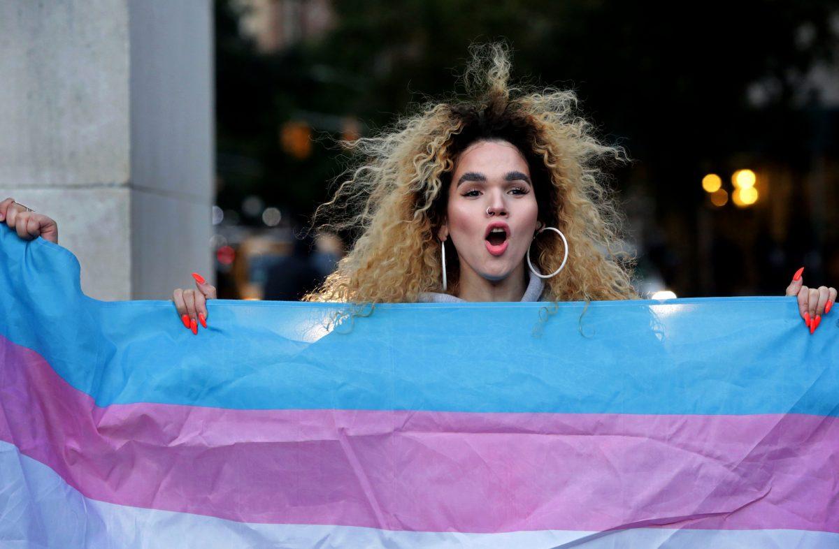 A person holds up a transgender flag at Washington Square Park in New York on Oct. 21, 2018. (Yana Paskova/Getty Images)