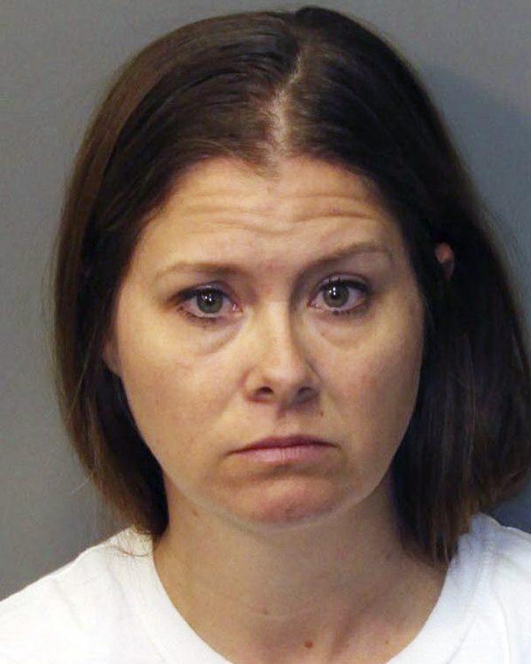 Jillian Godfrey, the mother of missing 8-year-old Noah McIntosh. Police said the boy's mother reported on March 12 that she couldn't reach her son. Authorities say they searched the father's apartment and found enough evidence to arrest him and Godfrey and charge both with child abuse. (Corona Police Department/AP)