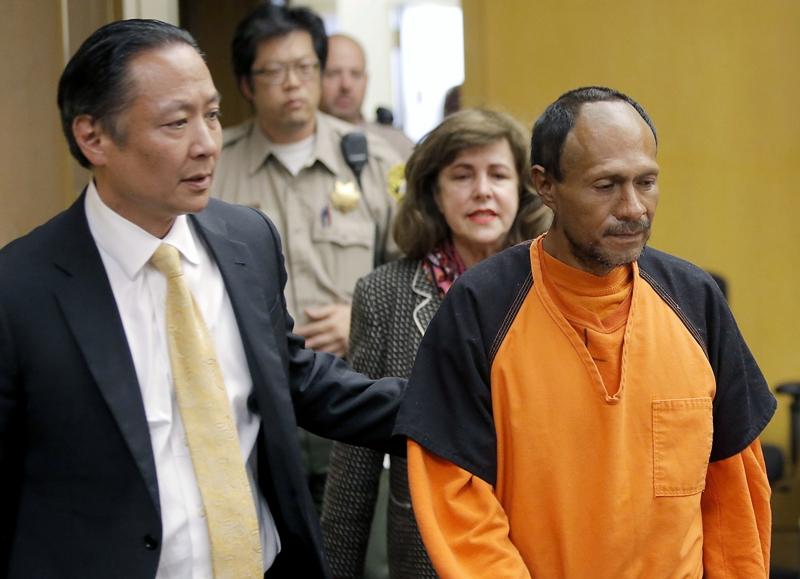 Jose Ines Garcia Zarate, right, is led into the courtroom by San Francisco Public Defender Jeff Adachi, left, and Assistant District Attorney Diana Garciaor, center, for his arraignment at the Hall of Justice in San Francisco, on July 7, 2015. (Michael Macor/San Francisco Chronicle via AP)