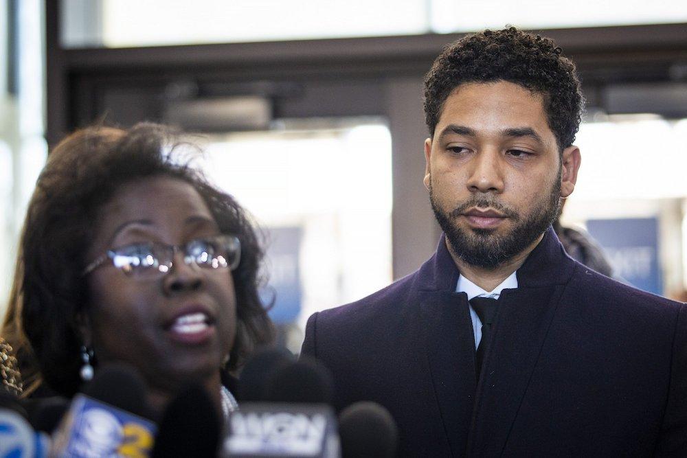 Actor Jussie Smollett, right, listens as his attorney, Patricia Brown Holmes, speaks to reporters at the Leighton Criminal Courthouse after prosecutors dropped all charges against him on March 26, 2019. (Ashlee Rezin/Sun-Times/Chicago Sun-Times via AP)