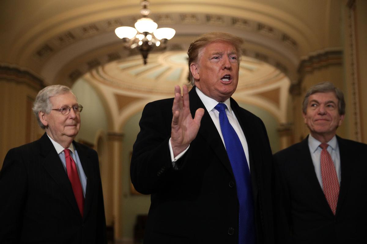 President Donald Trump (C) speaks as Senate Majority Leader Sen. Mitch McConnell (R-Ky.) (L), and Sen. Roy Blunt (R-Mo.) (R) look on in the U.S. Capitol on March 26, 2019. (Alex Wong/Getty Images)