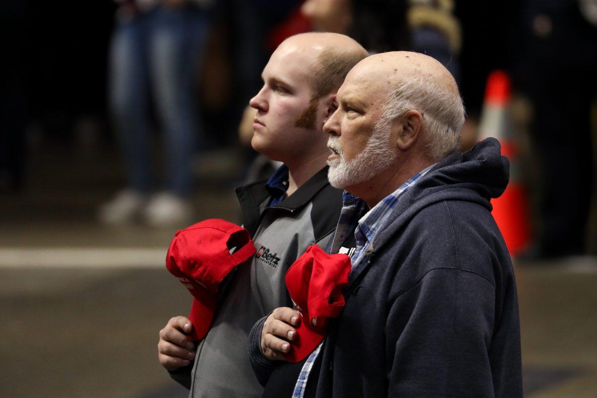 Audience members during the national anthem at President Donald Trump’s MAGA rally in Grand Rapids, Mich., on March 28, 2019. (Charlotte Cuthbertson/The Epoch Times)