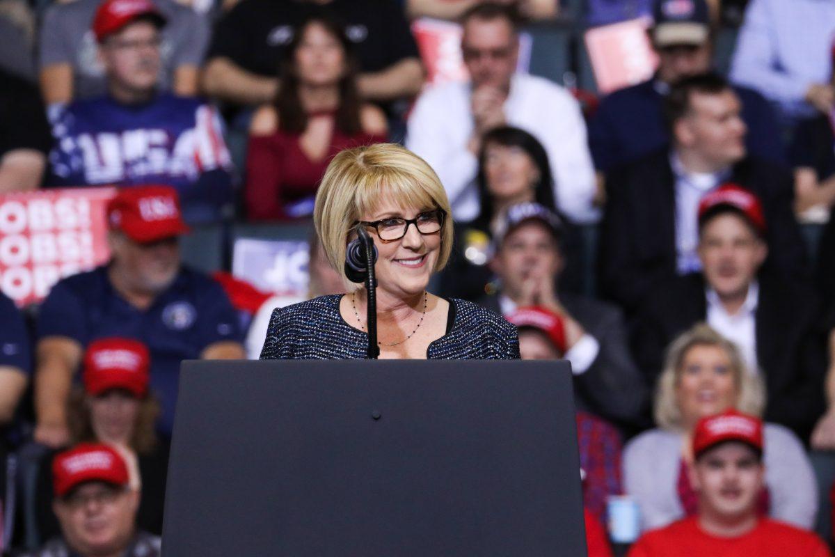 Laura Cox, head of the Michigan Republican Party, speaks at President Donald Trump’s MAGA rally in Grand Rapids, Mich., on March 28, 2019. (Charlotte Cuthbertson/The Epoch Times)