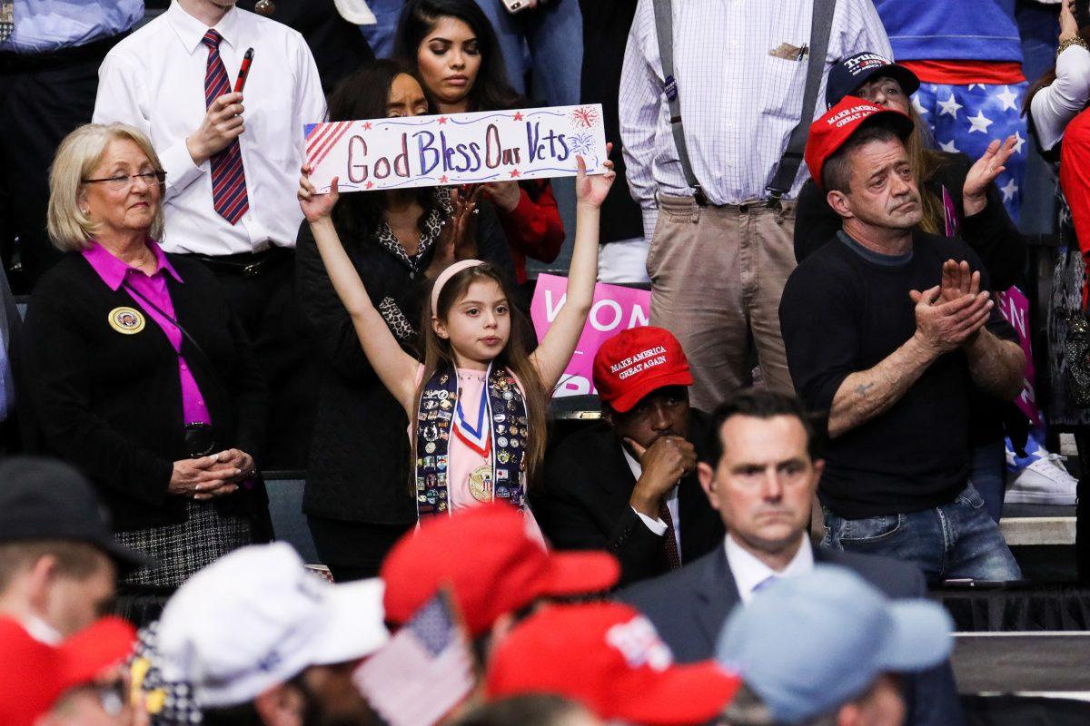 Audience members at President Donald Trump’s MAGA rally in Grand Rapids, Mich., on March 28, 2019. (Charlotte Cuthbertson/The Epoch Times)