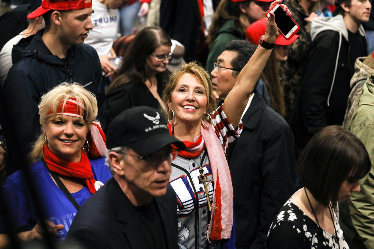 Audience members at President Donald Trump’s MAGA rally in Grand Rapids, Mich., on March 28, 2019. (Charlotte Cuthbertson/The Epoch Times)