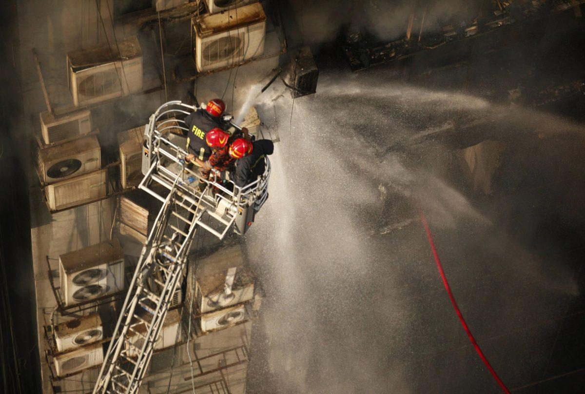 Firefighters work to douse a fire in a multi-storied office building in Dhaka, Bangladesh, on March 28, 2019. (Mahmud Hossain Opu/AP Photo)