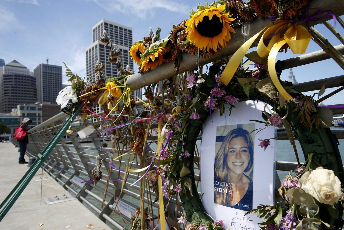Flowers and a portrait of Kate Steinle remain at a memorial site on Pier 14 in San Francisco, on July 17, 2015. (Paul Chinn/San Francisco Chronicle via AP)