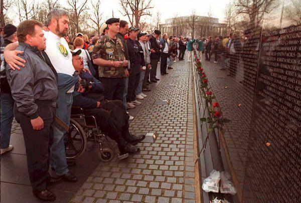 Vietnam veterans gather at the Vietnam War Memorial in Washington to commemorate the 20th anniversary of the end of the Vietnam War, on April 8, 1995. (Joyce Naltchayan/AFP/Getty Images)