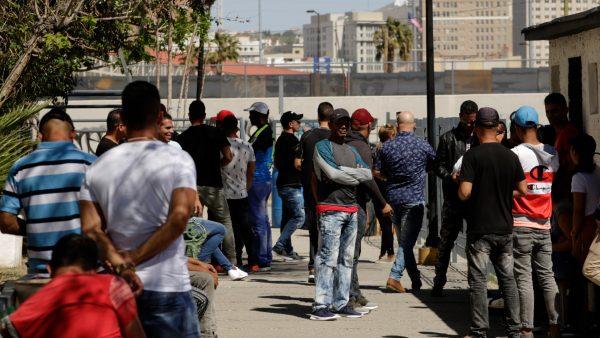 Cubans waiting for asylum in the United States are seen outside the premises of the migrant assistance office in Ciudad Juarez, Mexico, on March 29, 2019. (Jose Luis Gonzalez/Reuters)