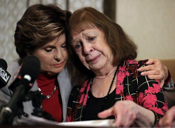 Attorney Gloria Allred, left, and Lorraine Borowski, mother of victim Lorry Ann react as they hold a news conference in Rosemont, Ill., on March 29, 2019. (Nam Y. Huh via AP)