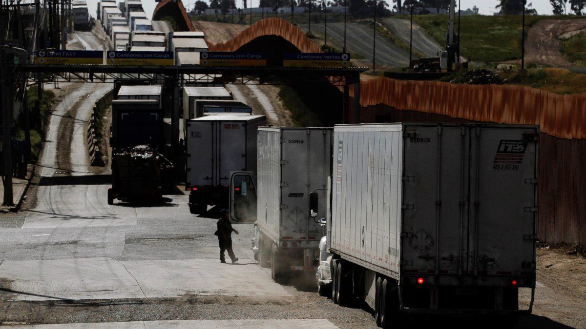 Trucks wait in a long queue for border customs control to cross into the U.S., at the Otay border crossing in Tijuana, Mexico, on March 29, 2019. (Jorge Duenes/Reuters)