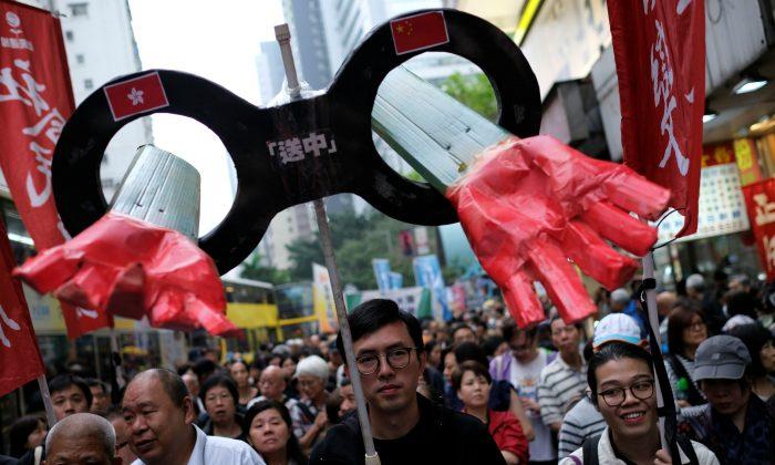 Thousands Protest Hong Kong’s Plans to Open Extradition to China