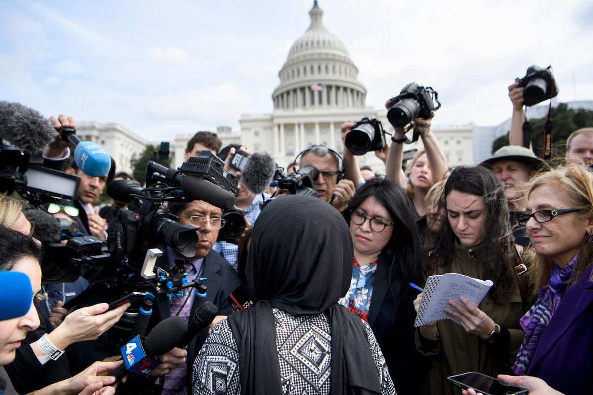 Rep. Ilhan Omar (D-Minn.) speaks to reporters during a youth climate rally on the west front of the U.S. Capitol in Washington on March 15, 2019. (BRENDAN SMIALOWSKI/AFP/Getty Images)