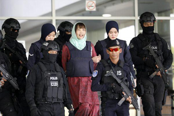 Vietnamese Doan Thi Huong, center, is escorted by police as she leaves Shah Alam High Court in Shah Alam, Malaysia, on April 1, 2019. (Vincent Thian/AP Photo)
