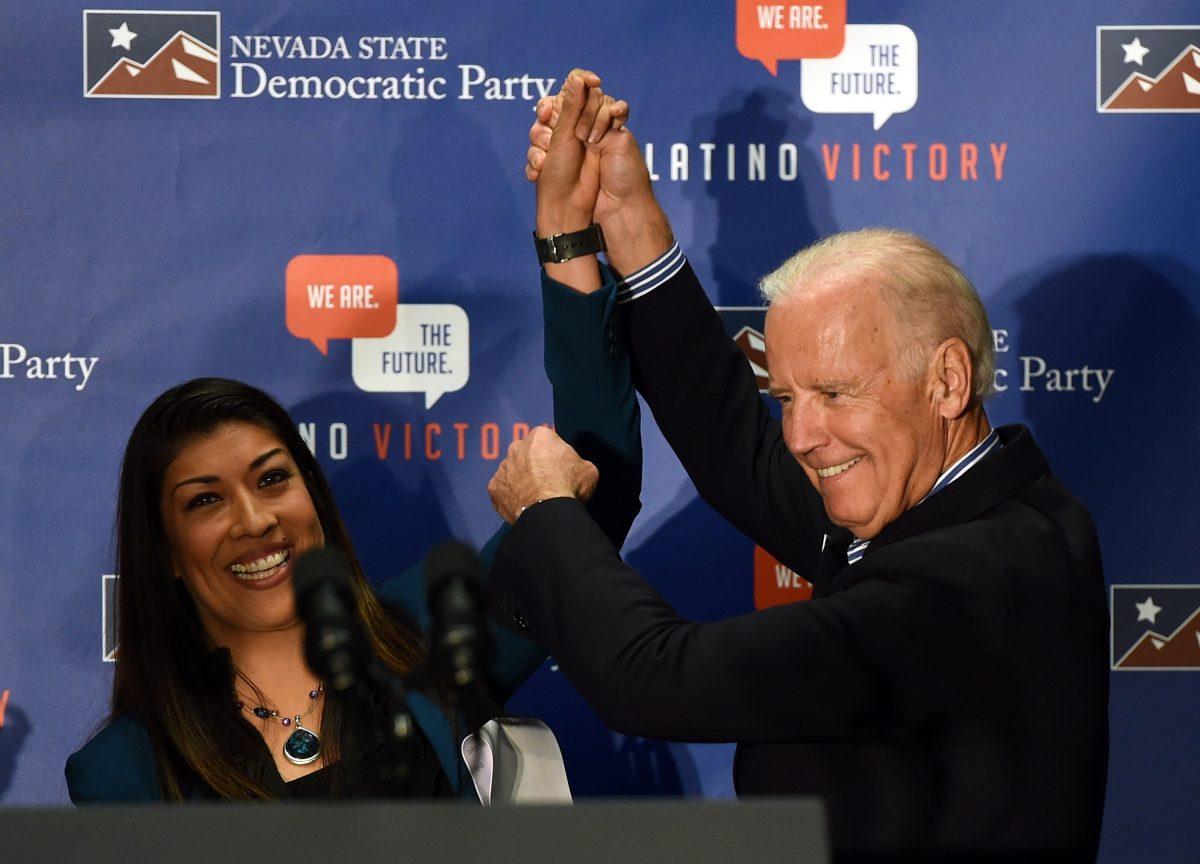 Democratic candidate for lieutenant governor and current Nevada Assemblywoman Lucy Flores (D-Las Vegas) (L) introduces Vice President Joe Biden at a get-out-the-vote rally at a union hall on Nov. 1, 2014, in Las Vegas. (Ethan Miller/Getty Images)
