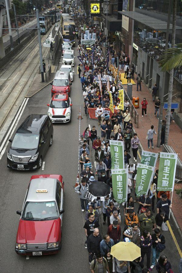 Protesters against an extradition law march toward the government headquarters in Hong Kong, on March 31, 2019. (Vincent Yu/AP Photo)