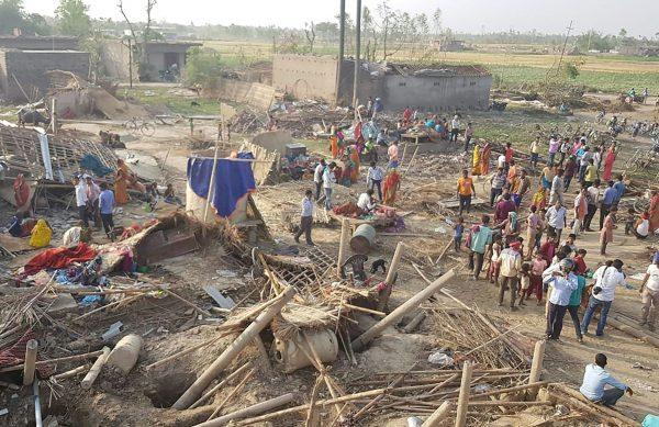 Nepali villagers search for belongings in the debris of damaged homes at Bhaluhi Bharbaliya village in Nepal's southern Bara district near Birgunj on April 1, 2019, the morning after a rare spring storm. (Prakash Mathema/AFP/Getty Images)