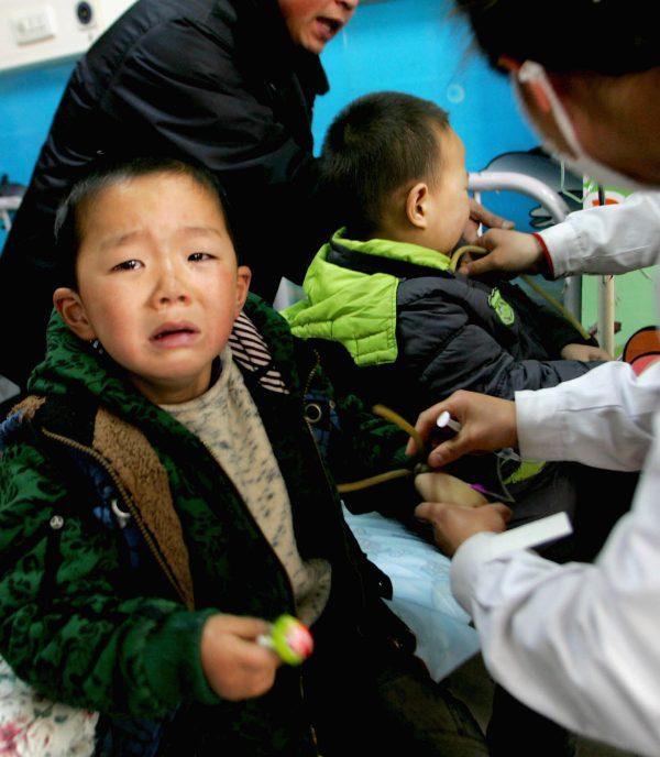 A child receives treatment for suspected nitrite poisoning. (Photo by VCG/VCG via Getty Images)