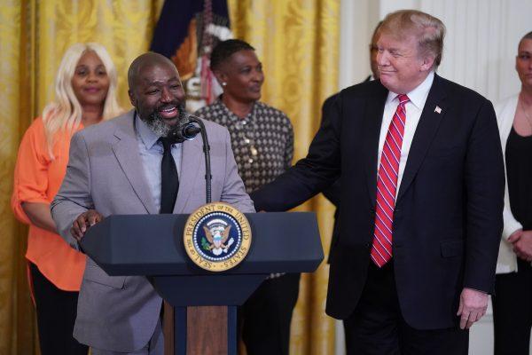 Matthew Charles, who was released from federal prison after serving 20 years for selling crack cocaine, joins President Donald Trump in the White House on April 1, 2019. (Chip Somodevilla/Getty Images)