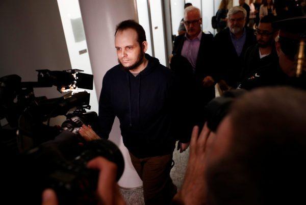 Joshua Boyle walks through the Toronto Pearson International Airport after arriving in Canada on Oct. 13, 2017, nearly five years after he and his wife were taken hostage in Afghanistan. (Mark Blinch/Reuters)