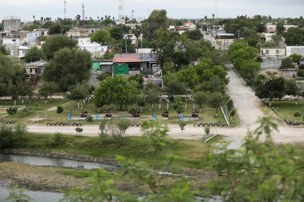 A view across the Rio Grande at Miguel Aleman, Mexico, where cartel houses can be seen from the Roma Bluffs near Rio Grande City, Texas, on March 22, 2019. (Charlotte Cuthbertson/The Epoch Times)