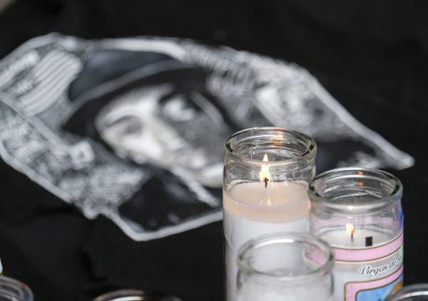 Candles appear at a makeshift memorial for rapper Nipsey Hussle in the parking lot of his Marathon Clothing store in Los Angeles, on April 1, 2019. (Ringo H.W. Chiu/AP Photo)