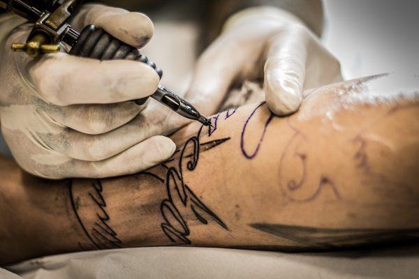 File photo of a tattoo being etched into someone's skin. (Pixabay)